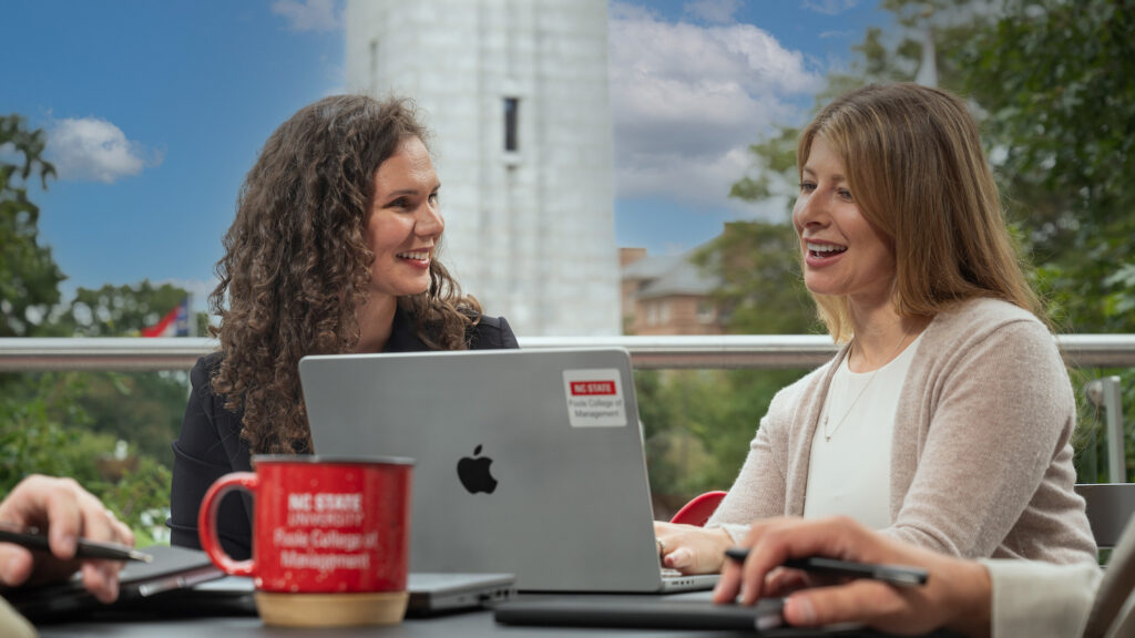 two graduate students working together