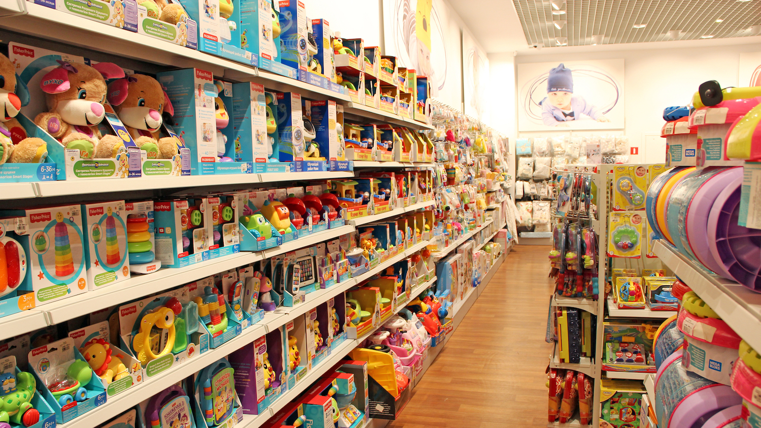 Shelves of toys for toddlers and babies in a shop.